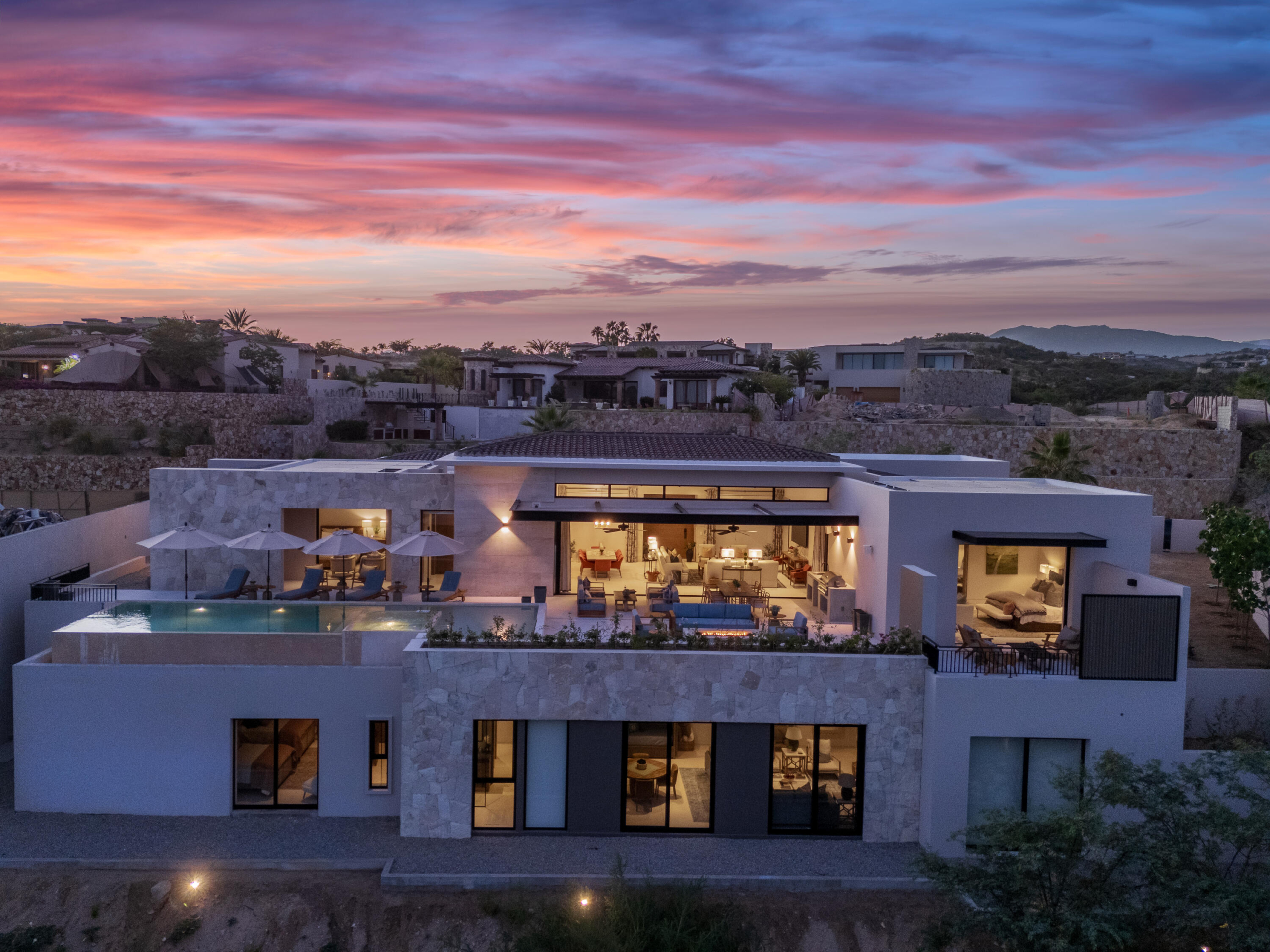 Querencia Section 18- Horizontes Welcome to Horizontes 3, an exquisite custom-made home located within San José del Cabo's most sought-after community, Querencia. Surrounded by Tom Fazio's signature golf course, recognized as one of the best in the country, this stunning residence is just a short golf cart ride from the prestigious 5-star Club House.This remarkable 6-bedroom, 6.5-bathroom home elevates luxury living with a fresh vision of architecture and design. The layout features a cozy family room, an expansive bunk bed bedroom on the lower level, and a spacious maid's quarters with an independent entrance, making it ideal for entertaining family and friends. The property boasts expansive outdoor living spaces, including tranquil green areas, an outdoor kitchen, an infinity pool, a jacuzzi, and breathtaking mountain for sale