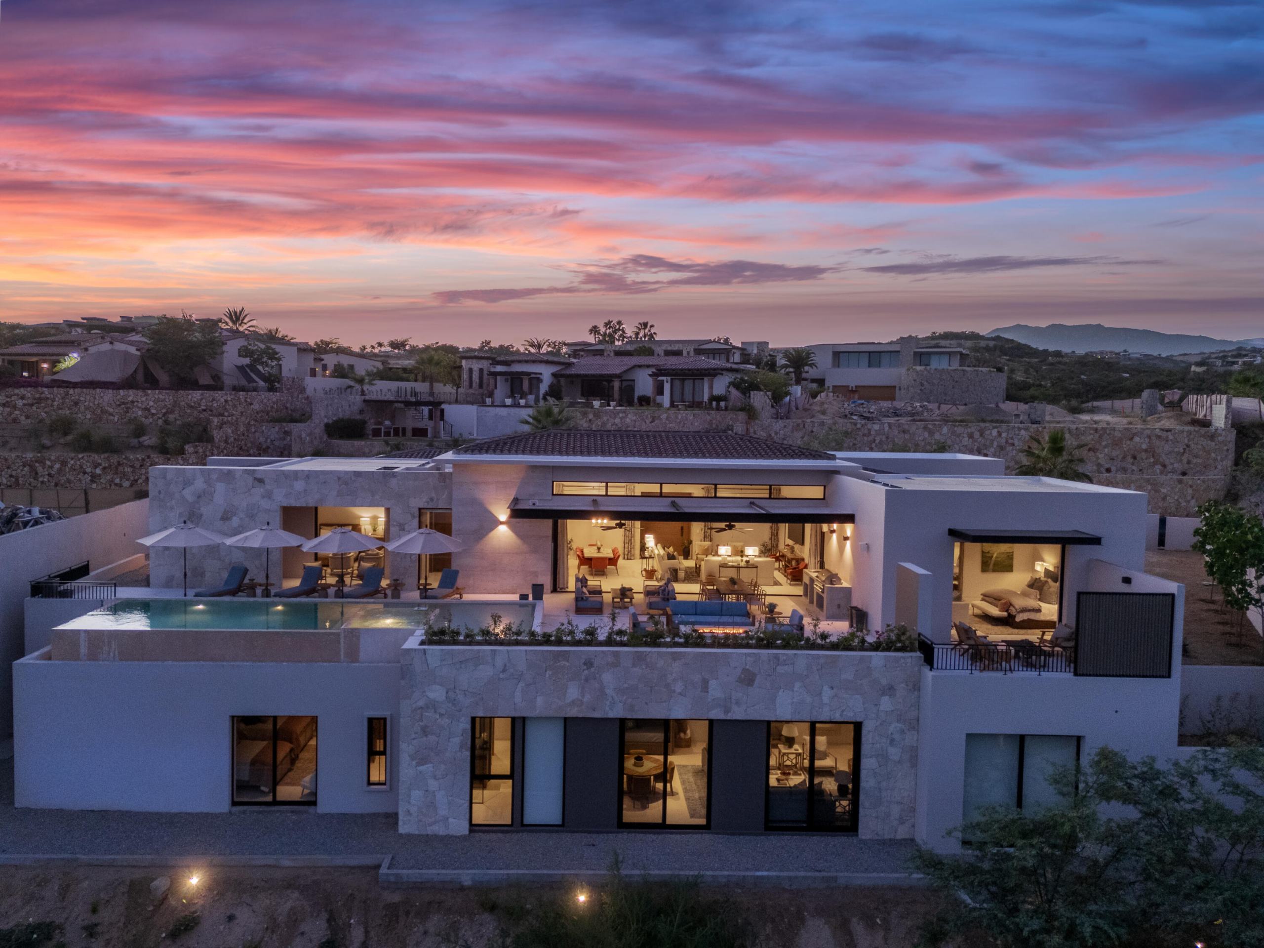Querencia Section 18- Horizontes Welcome to Horizontes 3, an exquisite custom-made home located within San José del Cabo's most sought-after community, Querencia. Surrounded by Tom Fazio's signature golf course, recognized as one of the best in the country, this stunning residence is just a short golf cart ride from the prestigious 5-star Club House.This remarkable 6-bedroom, 6.5-bathroom home elevates luxury living with a fresh vision of architecture and design. The layout features a cozy family room, an expansive bunk bed bedroom on the lower level, and a spacious maid's quarters with an independent entrance, making it ideal for entertaining family and friends. The property boasts expansive outdoor living spaces, including tranquil green areas, an outdoor kitchen, an infinity pool, a jacuzzi, and breathtaking mountain for sale