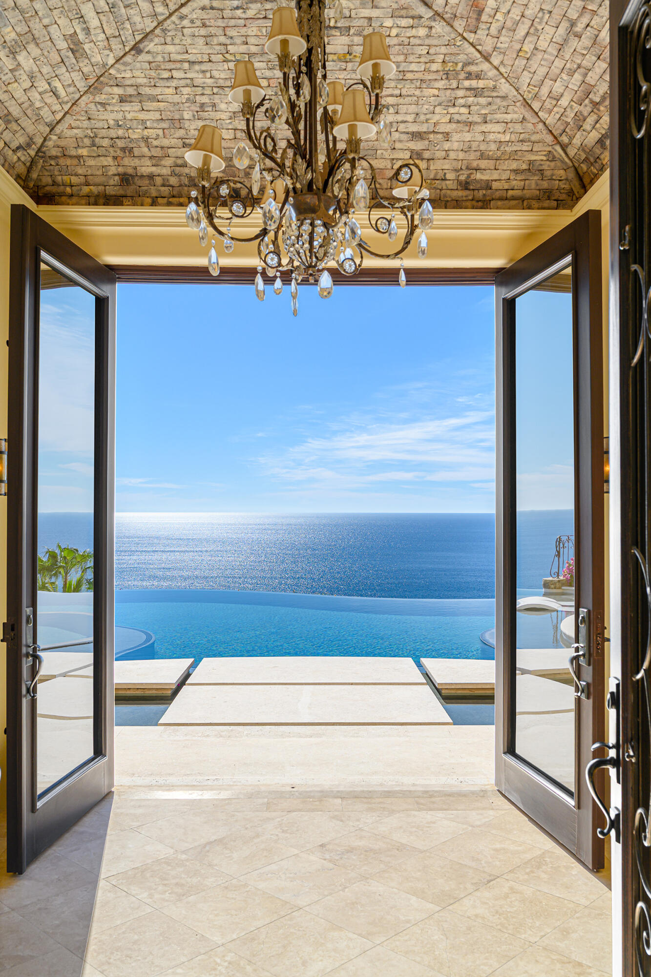 Querencia Section 4- Las Canadas Discover refined indoor-outdoor living at Cañada 9, set within Querencia, San Jose del Cabo's premier private golf community. Soaring beamed ceilings, walls of pocket glass, and luminous marble floors define an open great room that flows effortlessly to the terrace, infinity-edge pool, and stone-clad water feature -- all framed by panoramic Sea of Cortez and mountain for sale